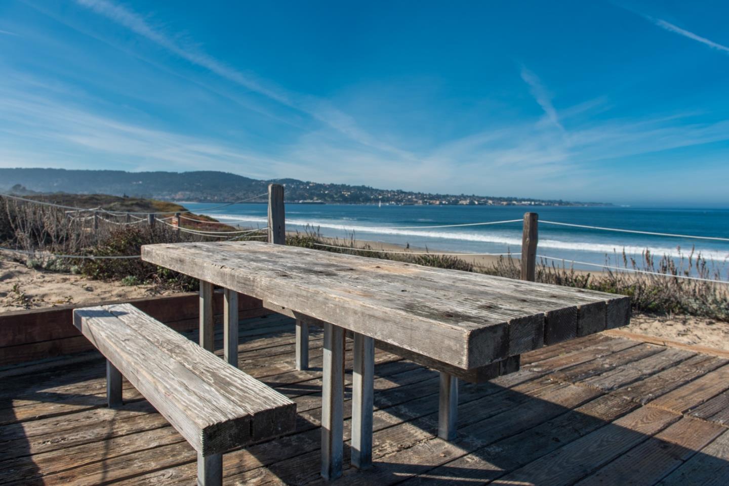 1 Surf Way, Unit 225 Monterey, CA 93940 - Photo 22 of 32 a roof deck with a table and chairs