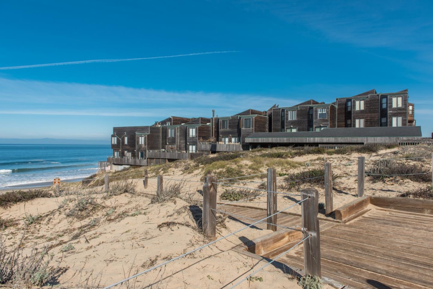 1 Surf Way, Unit 225 Monterey, CA 93940 - Photo 26 of 32 a view of a terrace with chairs and wooden floor