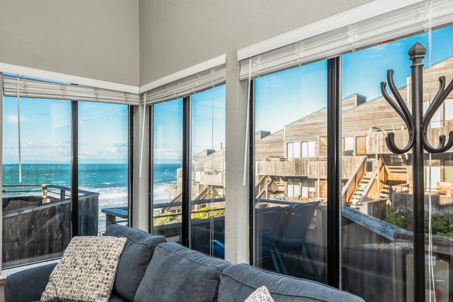 1 Surf Way, Unit 225 Monterey, CA 93940 - Photo 4 of 32 a bedroom with furniture and a large window