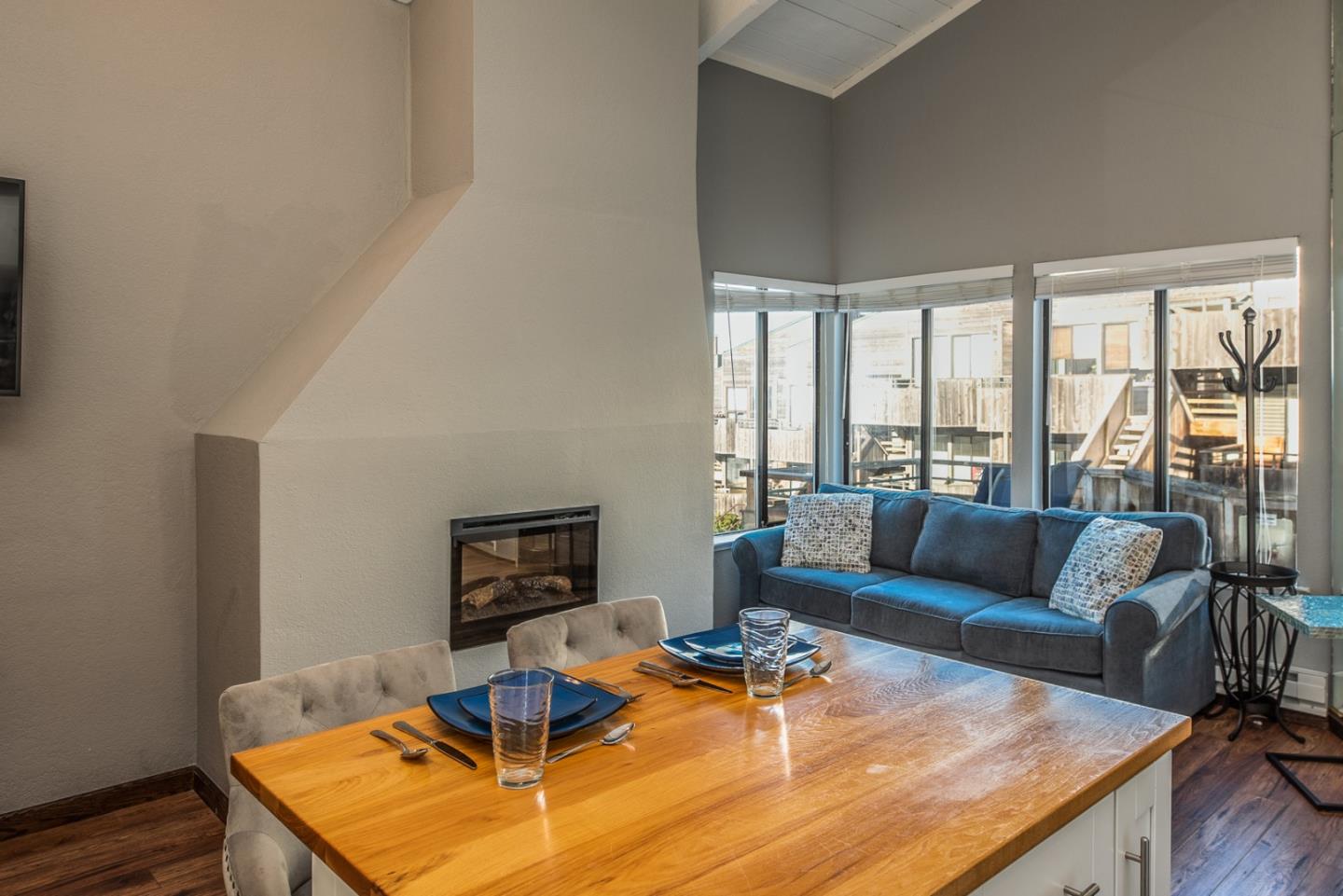 1 Surf Way, Unit 225 Monterey, CA 93940 - Photo 7 of 32 a living room with furniture and a table