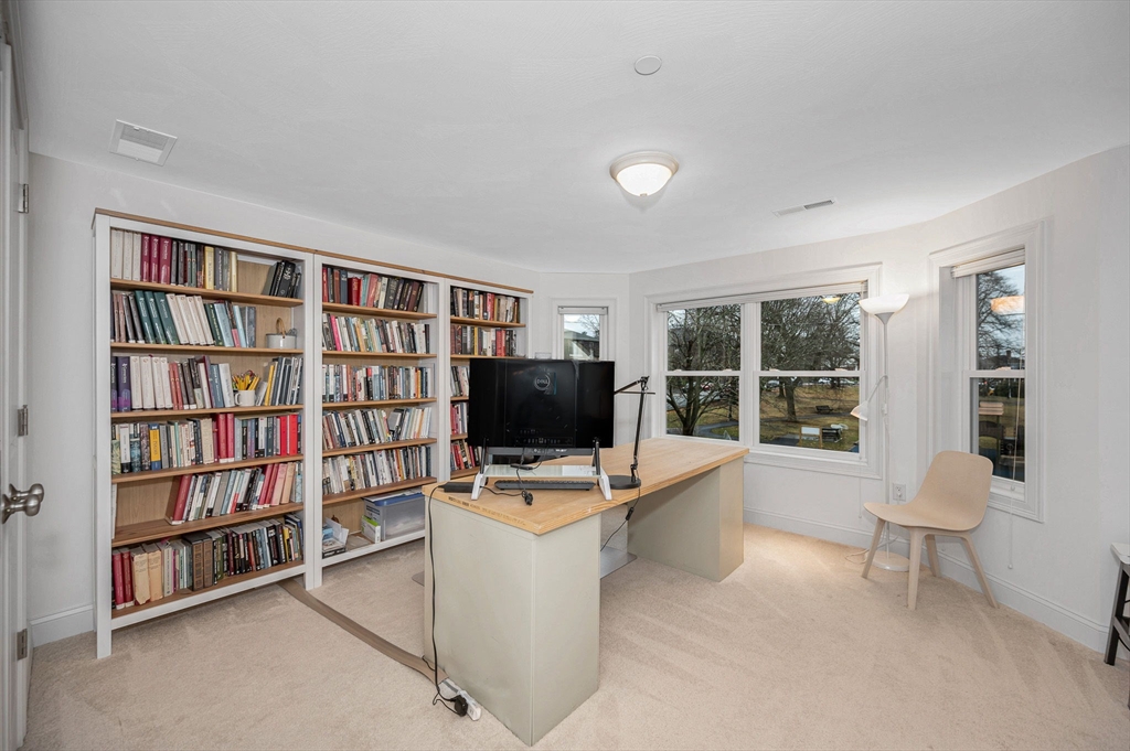 154 Chestnut Street, Unit 9 Lowell, MA 01852 - Photo 18 of 39 a view of a livingroom with workspace and a window