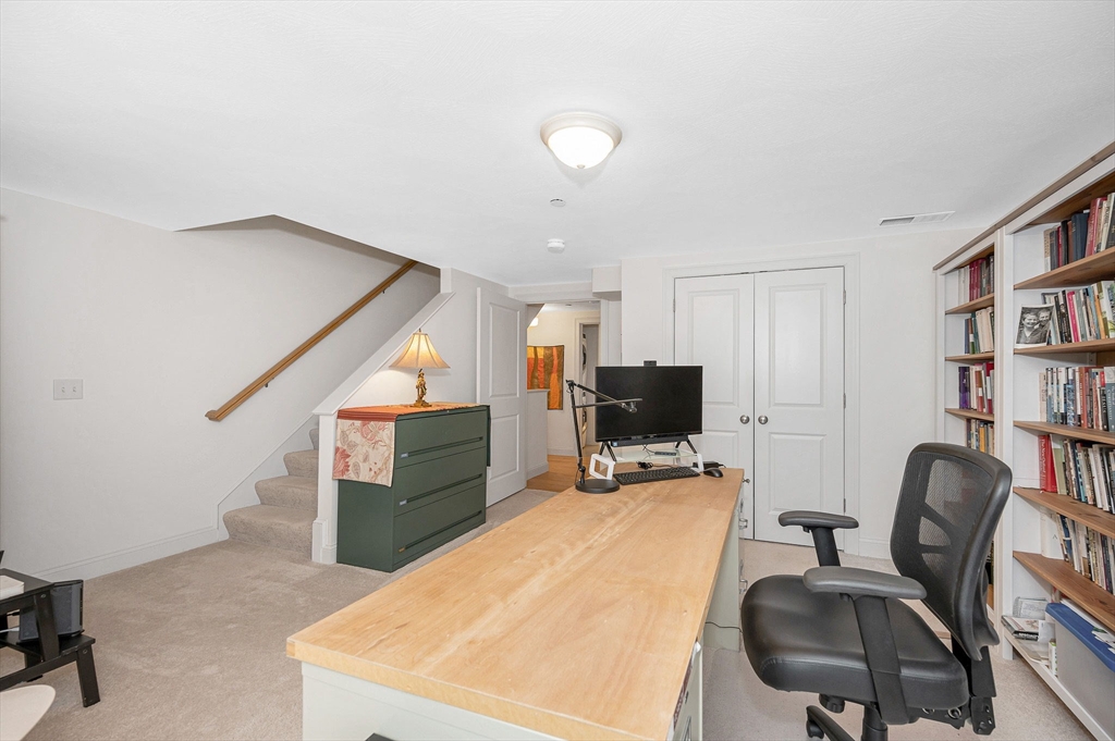 154 Chestnut Street, Unit 9 Lowell, MA 01852 - Photo 20 of 39 a workspace with furniture cabinet and a window