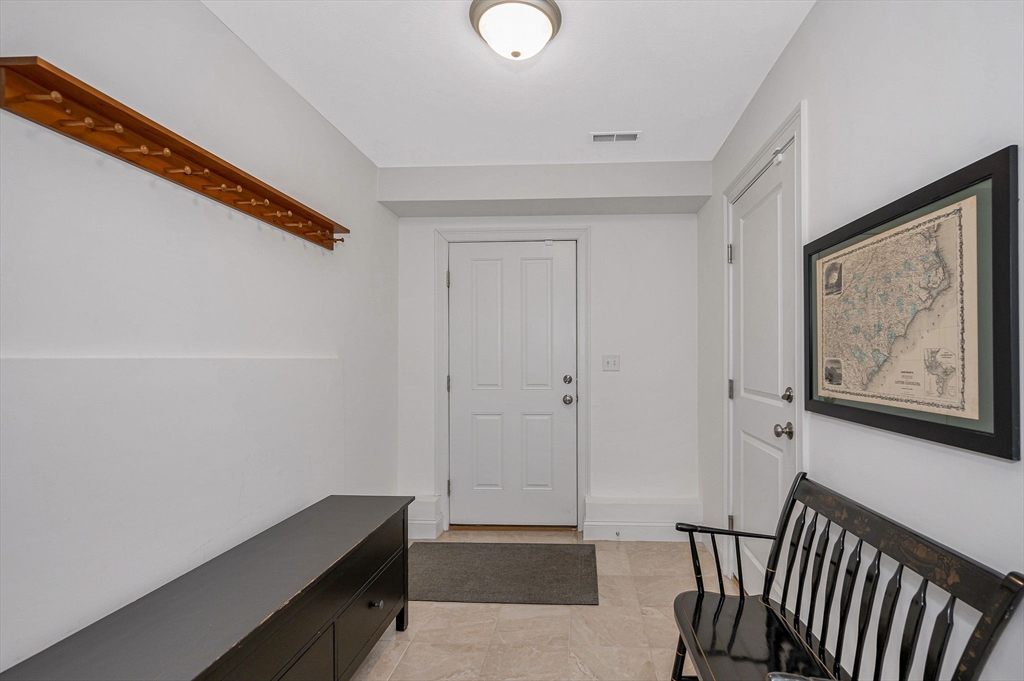 154 Chestnut Street, Unit 9 Lowell, MA 01852 - Photo 26 of 39 a view of room with window and hallway