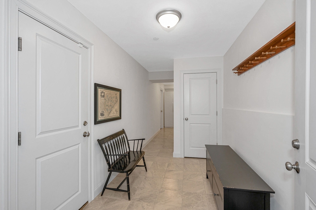 154 Chestnut Street, Unit 9 Lowell, MA 01852 - Photo 27 of 39 a view of a hallway with workspace