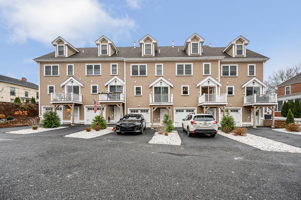 154 Chestnut Street, Unit 9 Lowell, MA 01852 - Photo 29 of 39 a view of street with parked cars