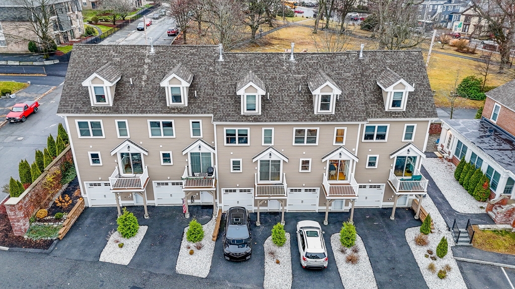 154 Chestnut Street, Unit 9 Lowell, MA 01852 - Photo 36 of 39 an aerial view of a house with swimming pool