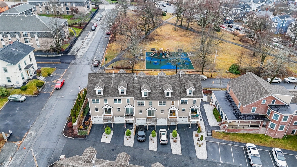 154 Chestnut Street, Unit 9 Lowell, MA 01852 - Photo 37 of 39 an aerial view of residential houses with outdoor space