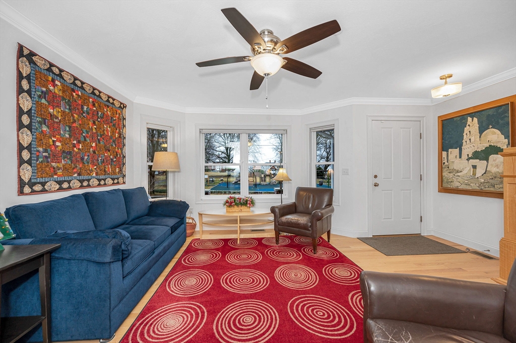 154 Chestnut Street, Unit 9 Lowell, MA 01852 - Photo 5 of 39 a living room with furniture and a large window