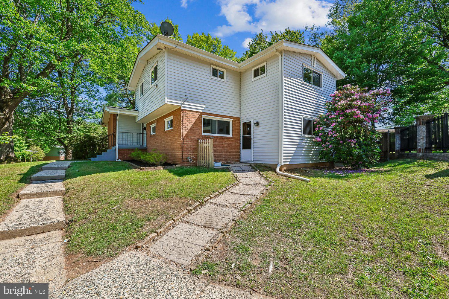 300 Gilsan Court Silver Spring, MD 20902 - Photo 31 of 117 a front view of house with yard and green space
