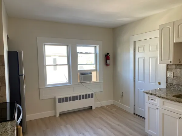 a room with window and furniture