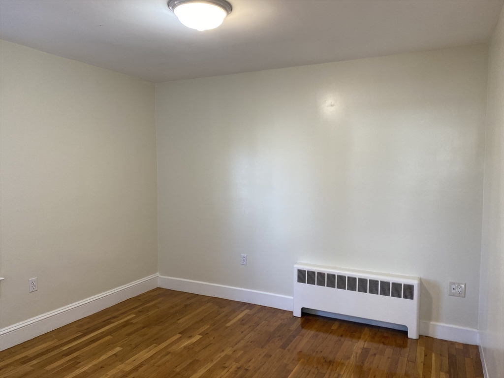 18 Highland Terrace, Unit 18 Needham, MA 02494 - Photo 10 of 14 a view of a room with wooden floor