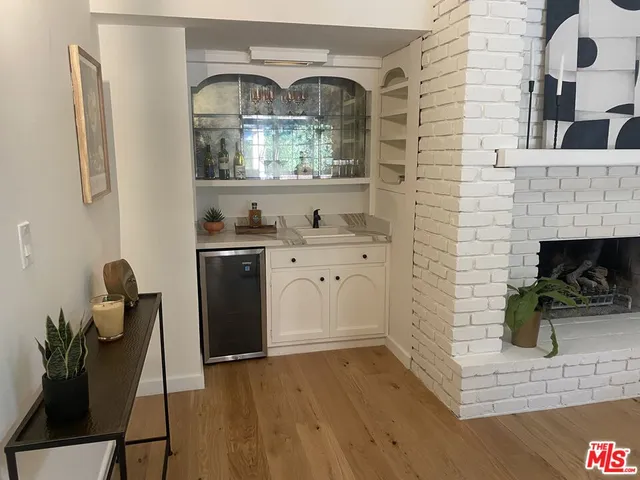 a bathroom with a sink mirror and toilet