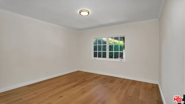 a living room with furniture rug and wooden floor