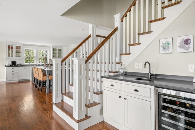 a living room with furniture window and wooden floor