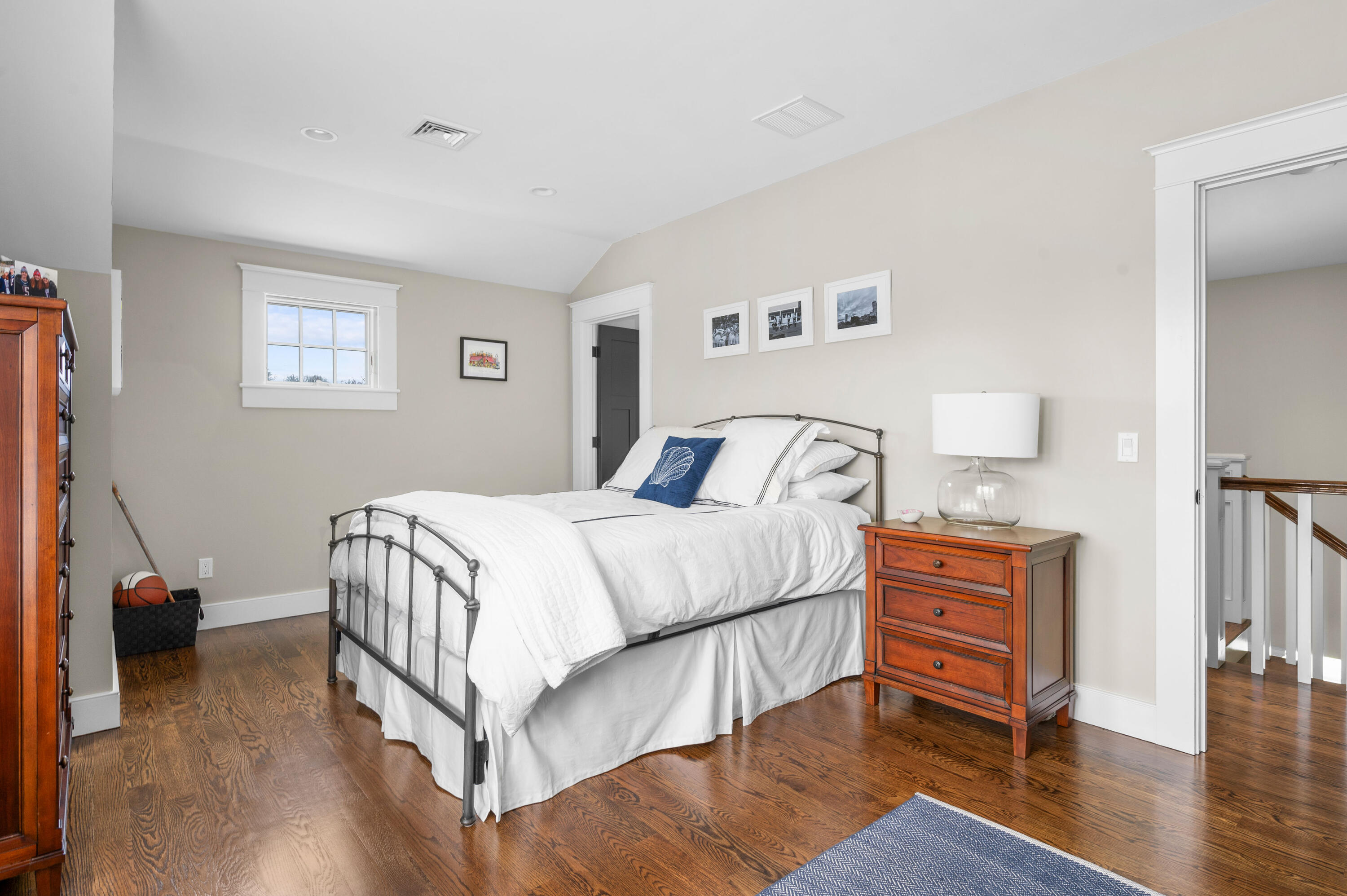 189 Harbor Point Road Barnstable, MA 02675 - Photo 29 of 68 a bedroom with a bed and wooden floor