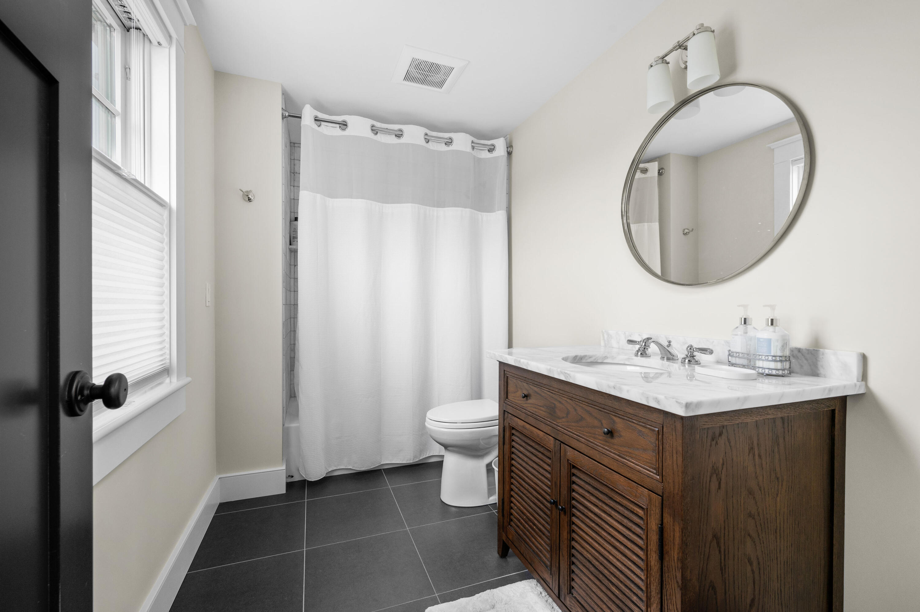 189 Harbor Point Road Barnstable, MA 02675 - Photo 32 of 68 a bathroom with a toilet a sink and a mirror