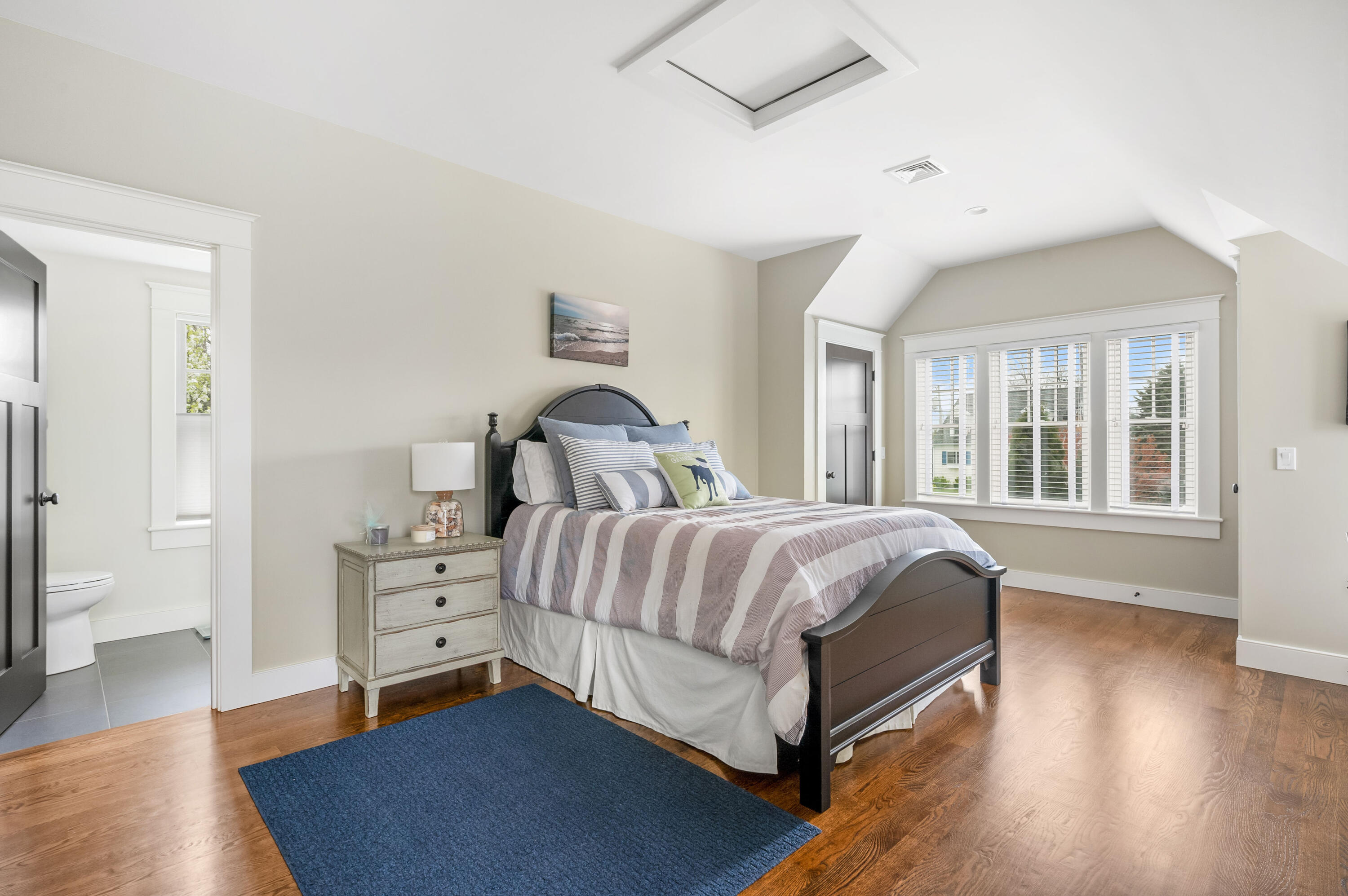 189 Harbor Point Road Barnstable, MA 02675 - Photo 33 of 68 a spacious bedroom with a bed and wooden floor