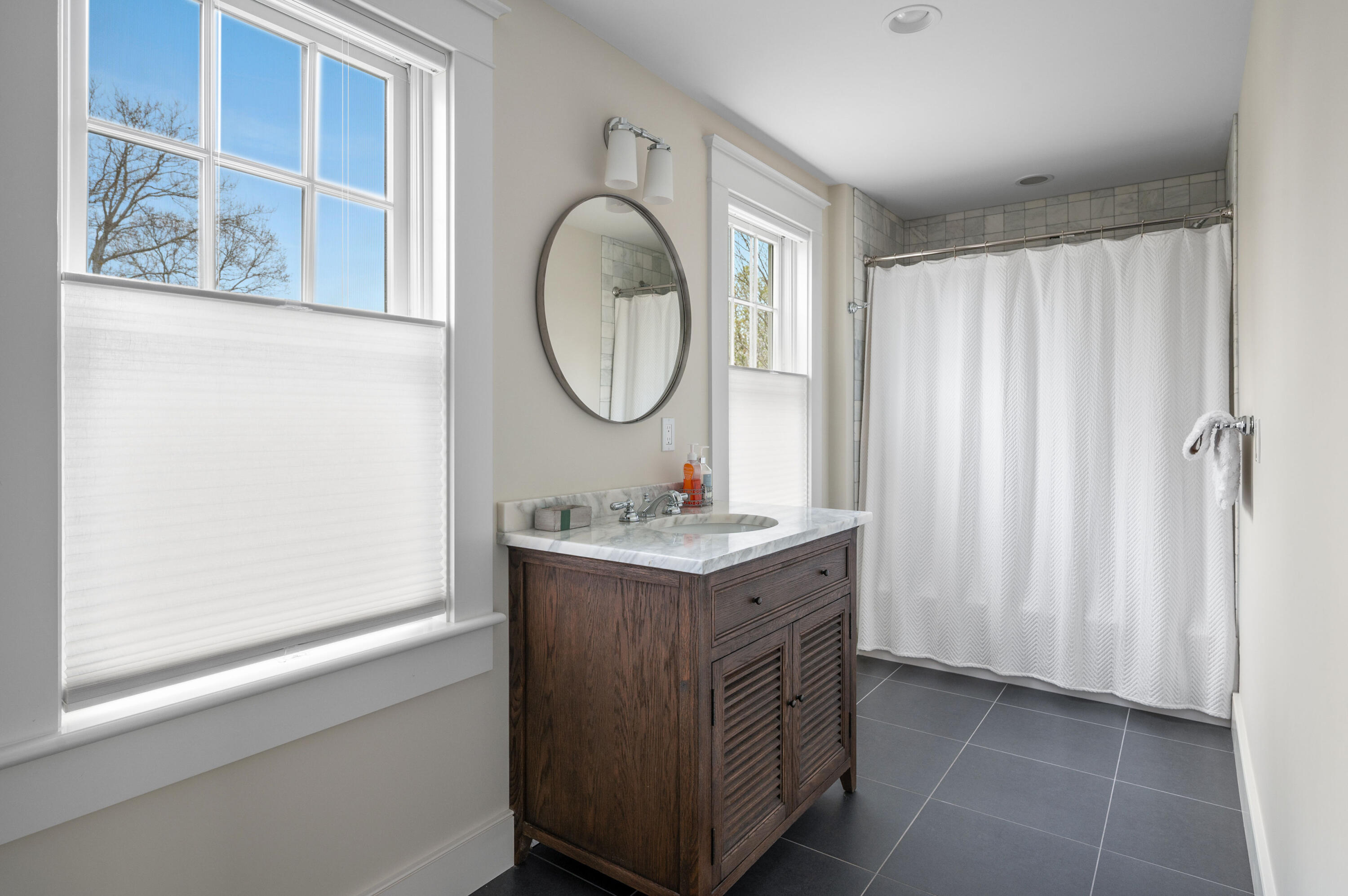 189 Harbor Point Road Barnstable, MA 02675 - Photo 35 of 68 a bathroom with a granite countertop sink and a mirror