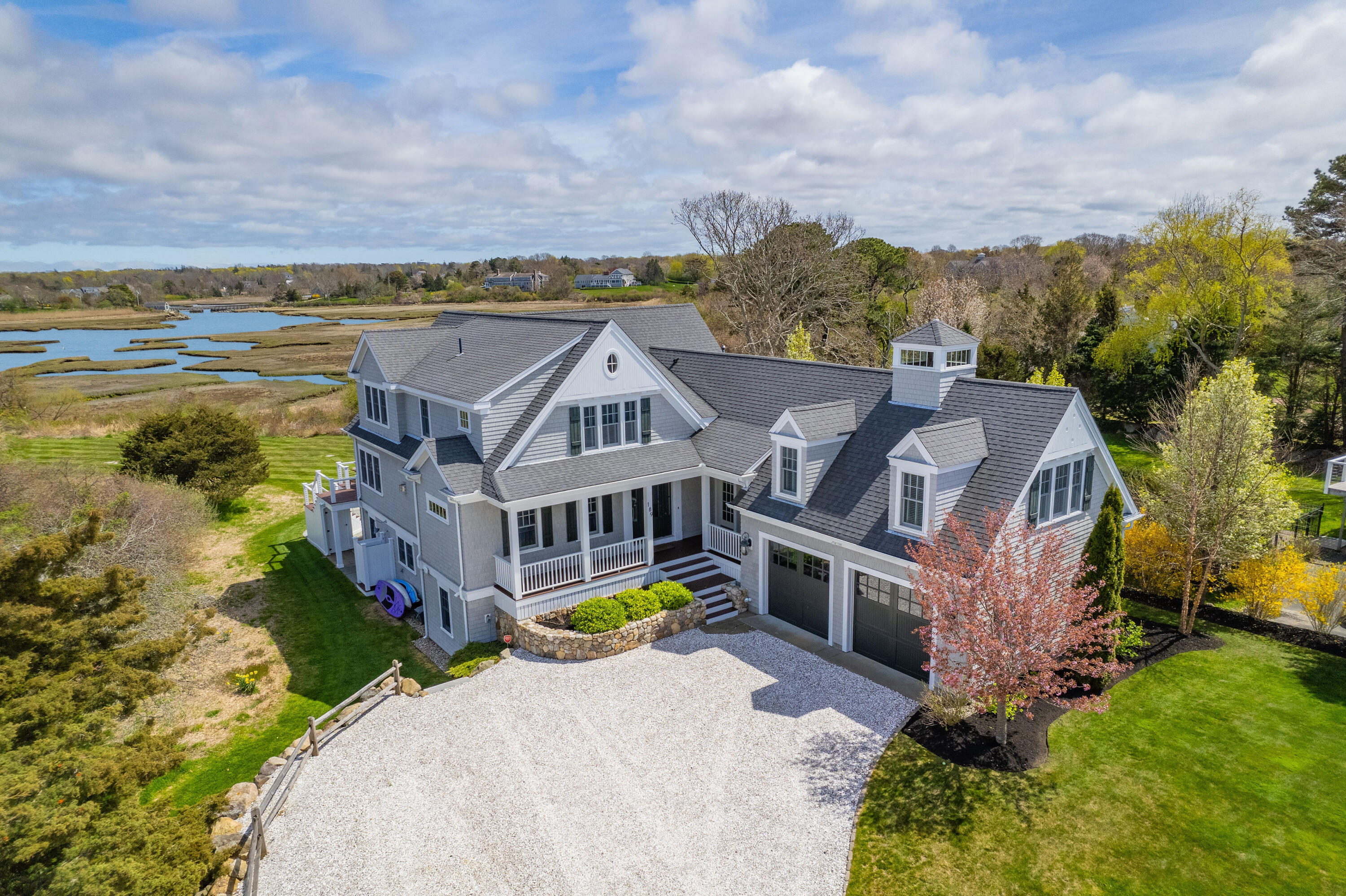 189 Harbor Point Road Barnstable, MA 02675 - Photo 4 of 68 an aerial view of a house with a garden and lake view