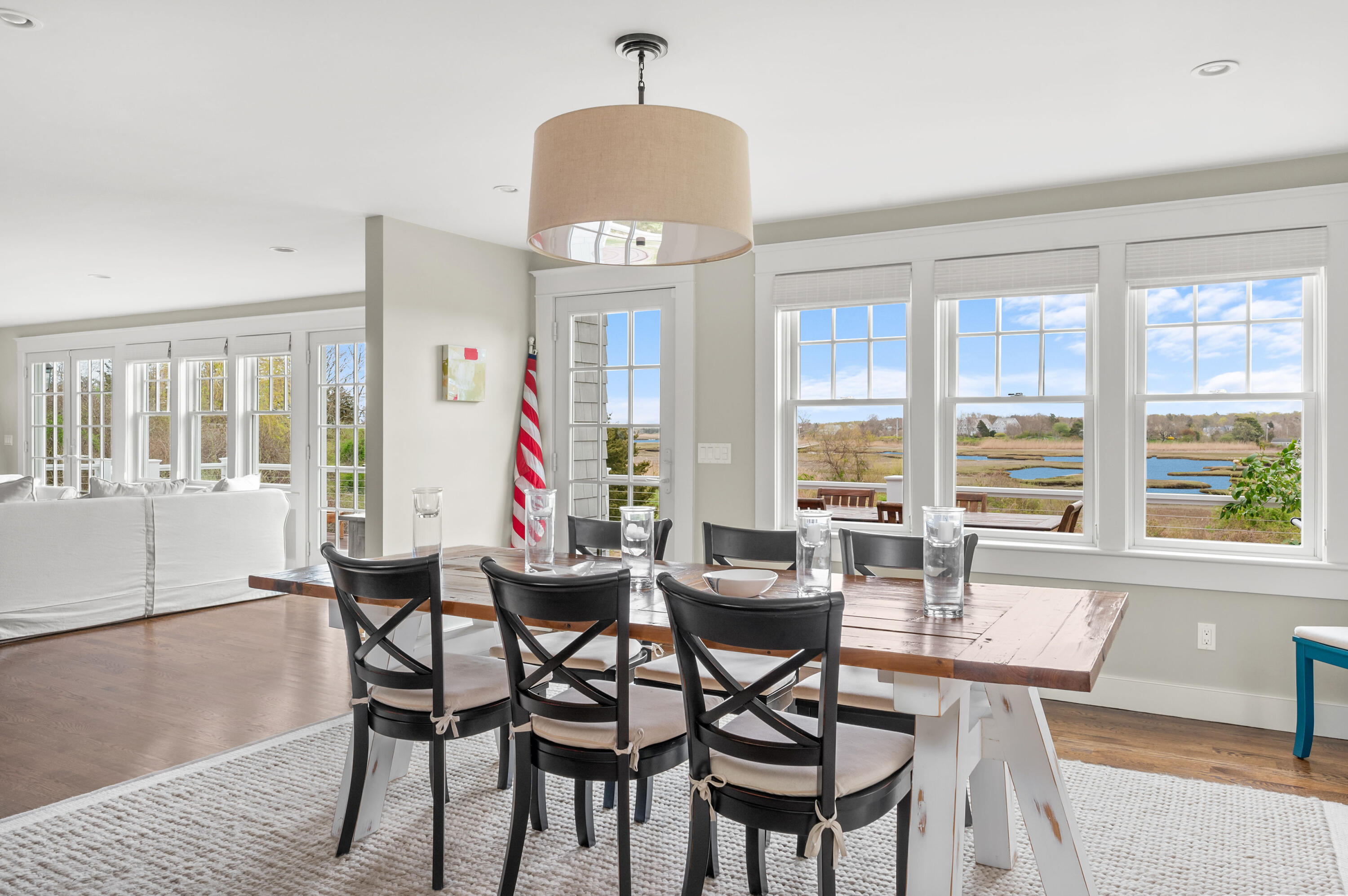 189 Harbor Point Road Barnstable, MA 02675 - Photo 10 of 68 a dining room with furniture a chandelier and wooden floor