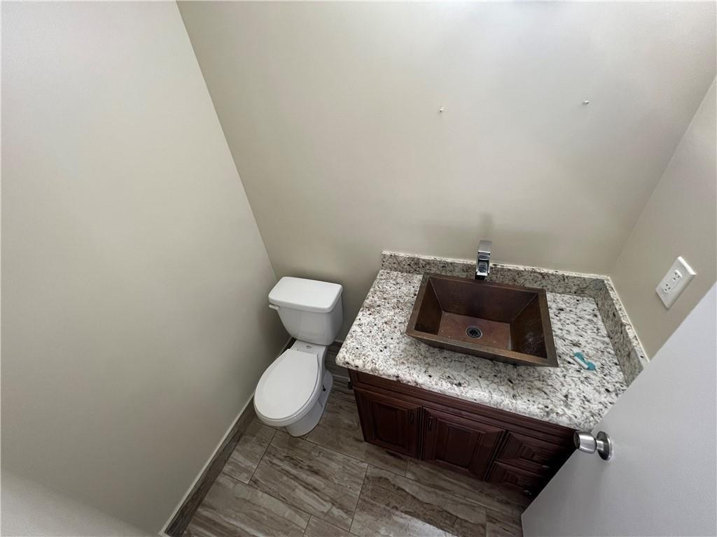 9380 Southwest 61st Way, Unit C Boca Raton, FL 33428 - Photo 32 of 32 a bathroom with a sink and toilet