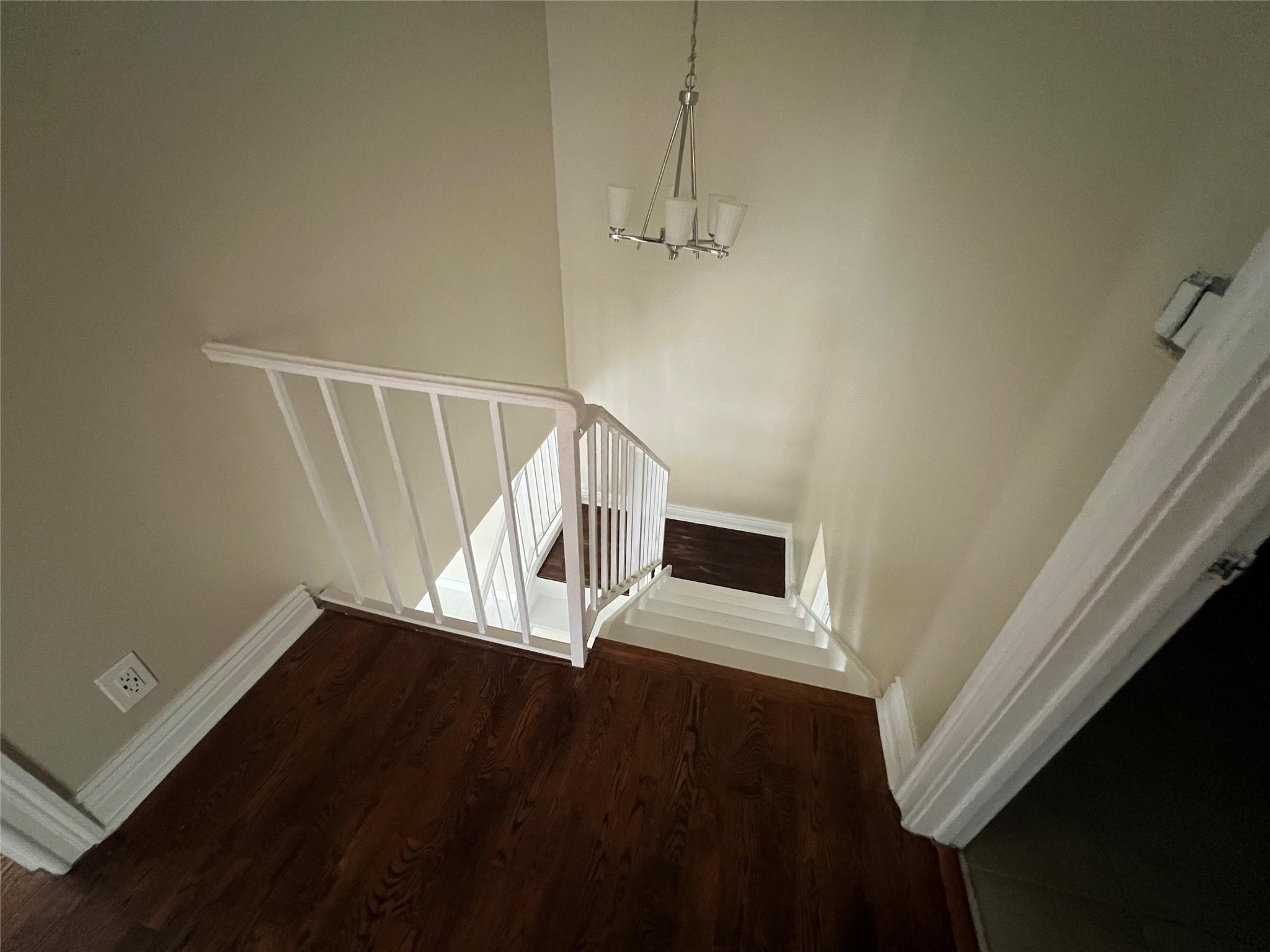 9380 Southwest 61st Way, Unit C Boca Raton, FL 33428 - Photo 5 of 32 a view of an empty room with wooden floor and a window