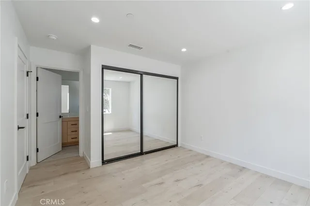 a bathroom with a toilet a sink and shower