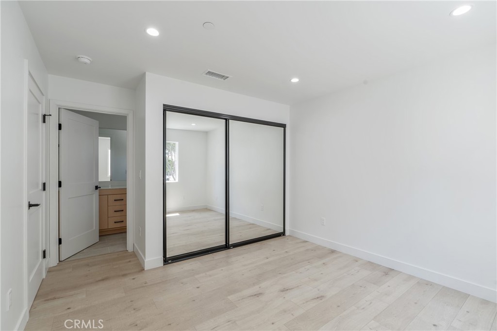 7437 Ranchito Avenue Van Nuys, CA 91405 - Photo 5 of 9 an empty room with closet area