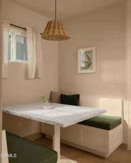 a kitchen with appliances a sink and cabinets