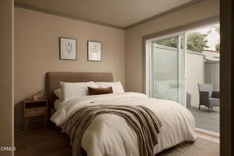 a bedroom with a bed and a mirror