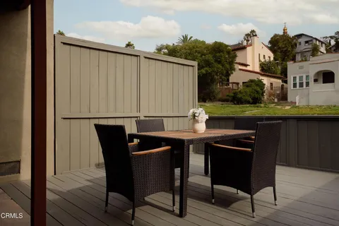 a bedroom with a bed and table chair