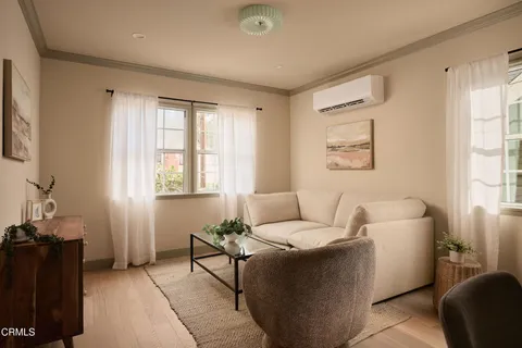 a living room with furniture and a window