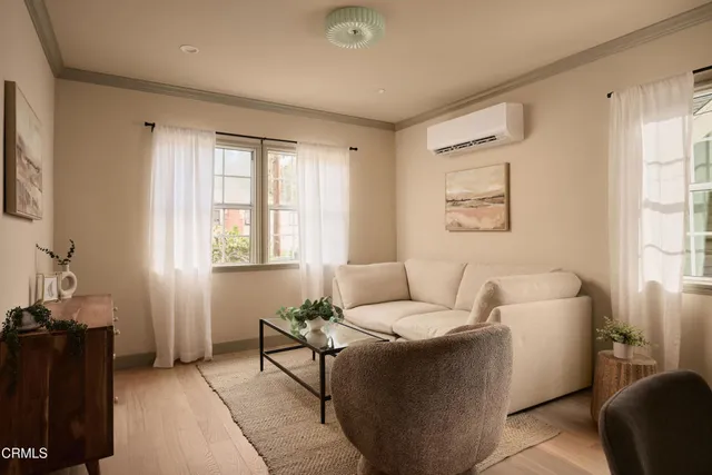 a living room with furniture and a window