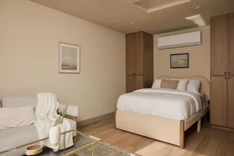 a room with a refrigerator and a sink