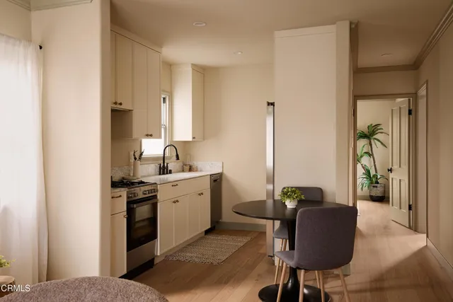 a white stove top oven sitting inside of a kitchen