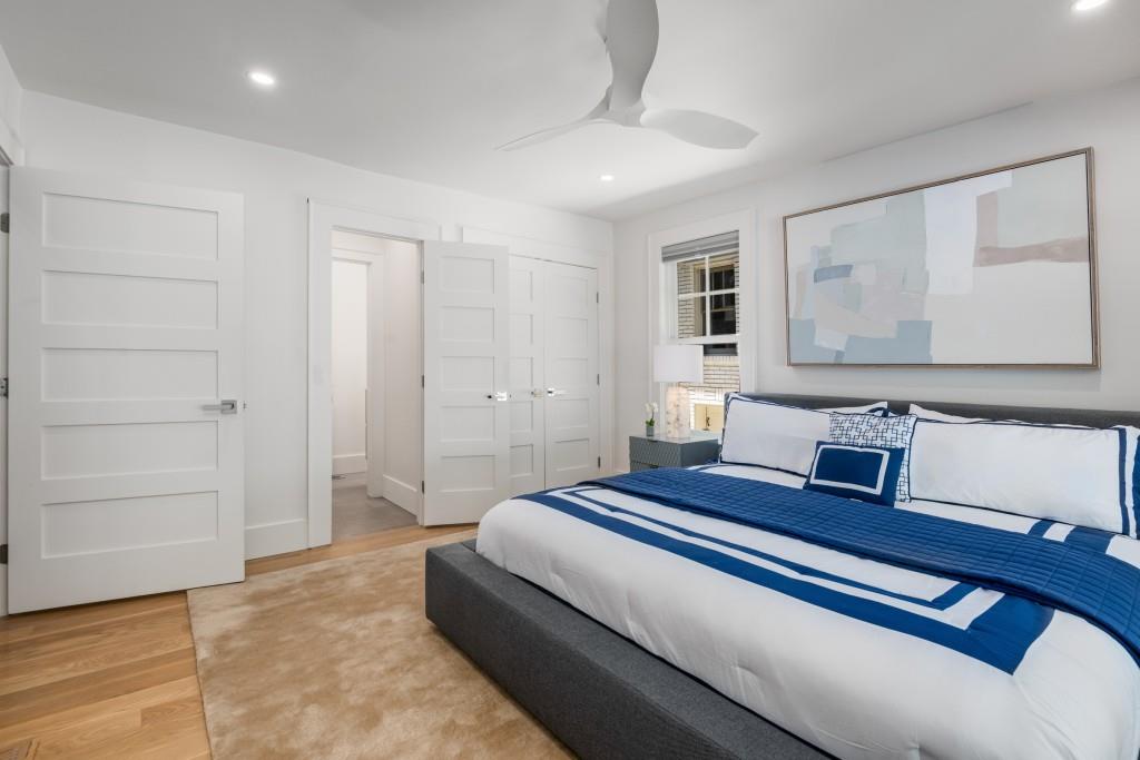 413 8th Street Northeast, Unit A Atlanta, GA 30309 - Photo 12 of 31 a spacious bedroom with a bed and cabinet