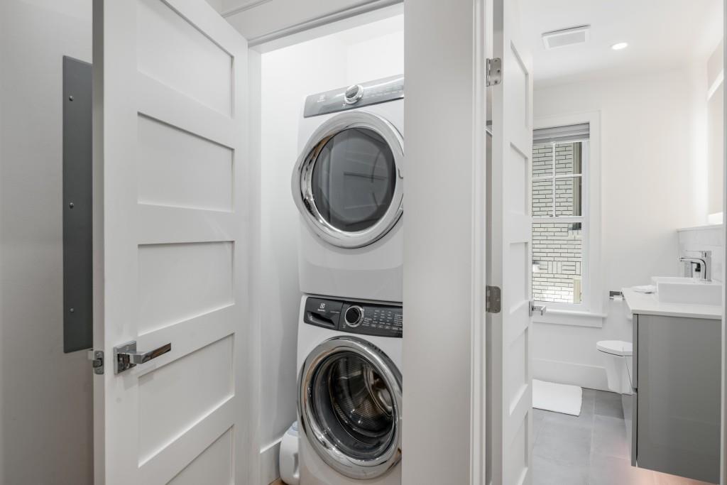 413 8th Street Northeast, Unit A Atlanta, GA 30309 - Photo 17 of 31 a utility room with cabinets dryer and washer
