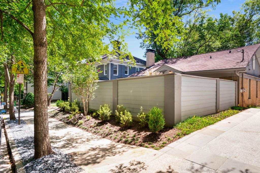 413 8th Street Northeast, Unit A Atlanta, GA 30309 - Photo 27 of 31 a front view of a house with garden