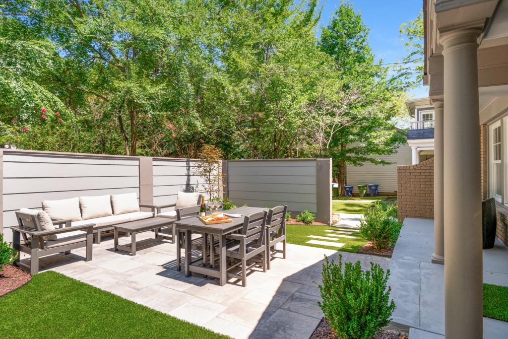 413 8th Street Northeast, Unit A Atlanta, GA 30309 - Photo 3 of 31 a view of a backyard with sitting area