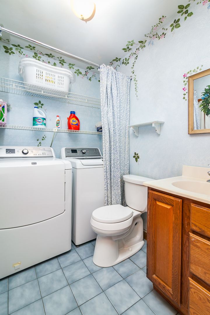 345 Dunbar Road Mundelein, IL 60060 - Photo 35 of 35 a utility room with cabinets washer and dryer