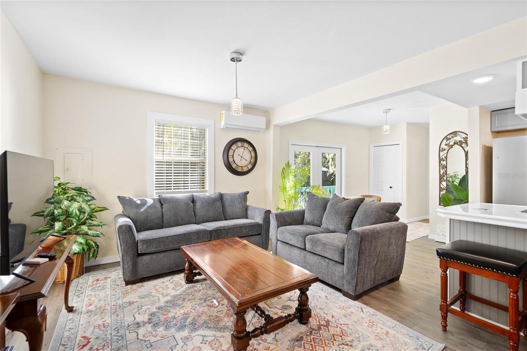 245 South Rhodes Street Mount Dora, FL 32757 - Photo 13 of 64 a living room with furniture and a clock