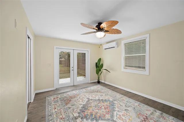 a bathroom with a tub a sink and a large mirror