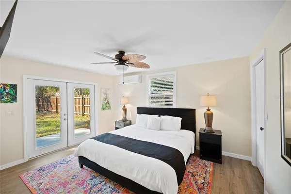 a bedroom with a bed and a chandelier