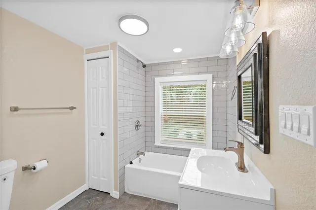 a bathroom with a shower and a toilet