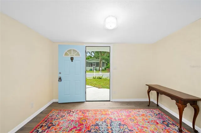 a view of a room with window and wooden floor
