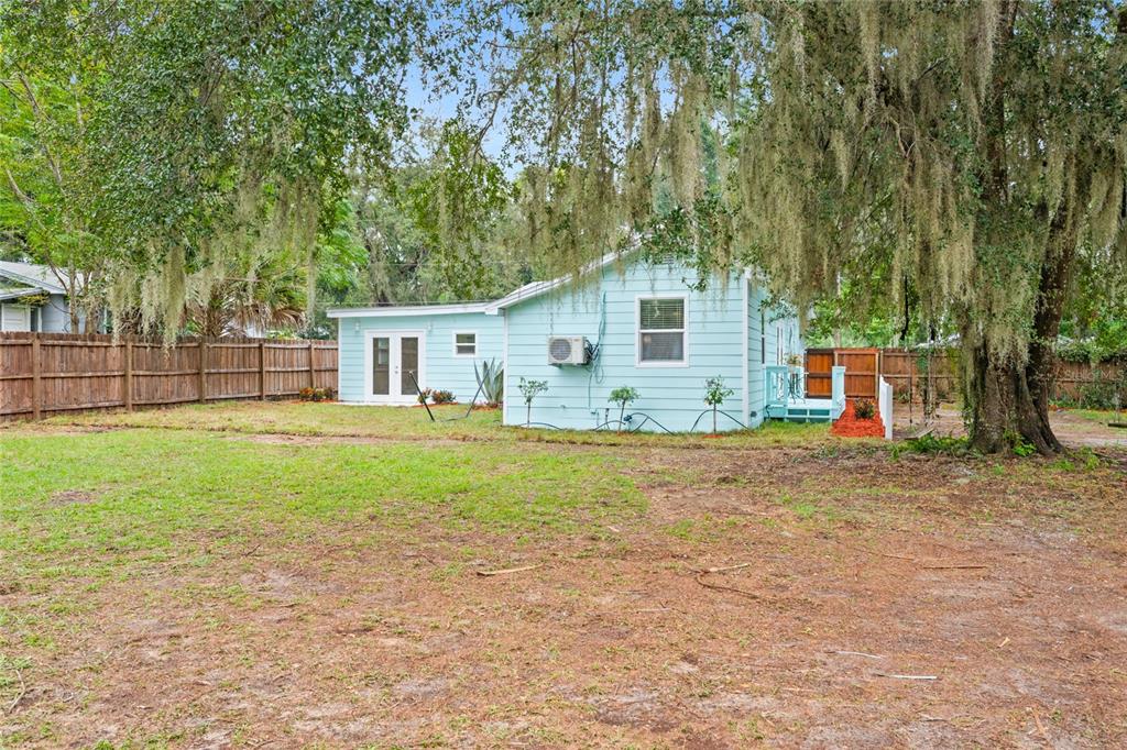245 South Rhodes Street Mount Dora, FL 32757 - Photo 30 of 64 a view of backyard of house with green space