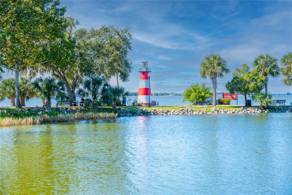 245 South Rhodes Street Mount Dora, FL 32757 - Photo 35 of 64 a street with trees and houses in the background