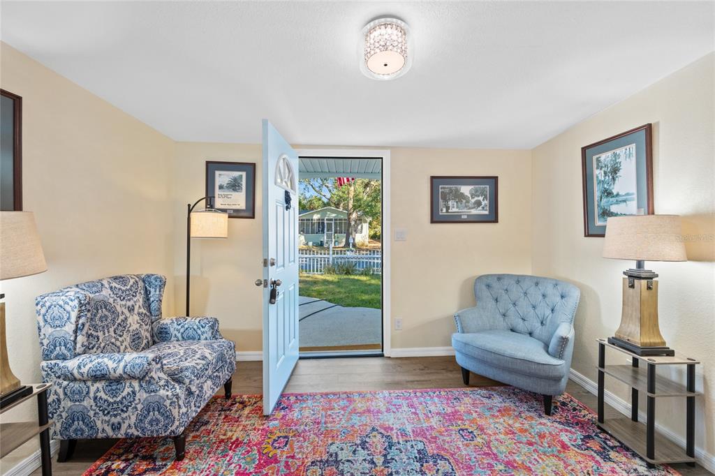 245 South Rhodes Street Mount Dora, FL 32757 - Photo 5 of 64 a living room with furniture and a couch