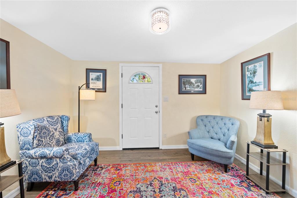 245 South Rhodes Street Mount Dora, FL 32757 - Photo 6 of 64 a living room with furniture and a couch