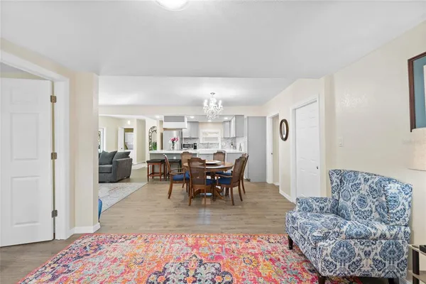 a living room with furniture and a clock